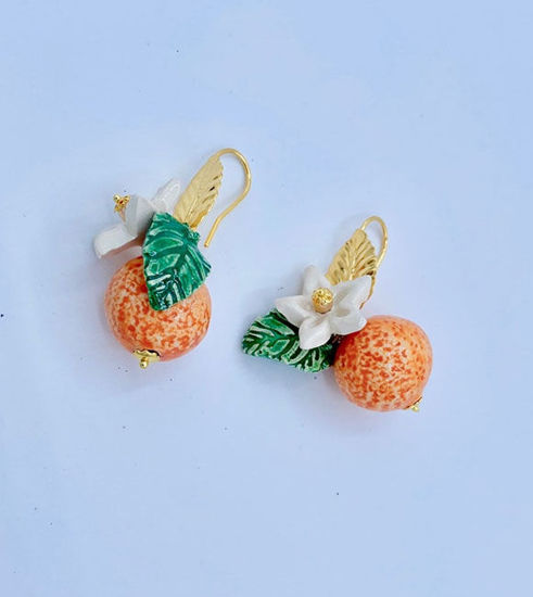 Picture of Orange earrings with white flower and leaf