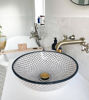 Handmade black and white Moroccan ceramic sink with intricate patterns, showcasing Mediterranean artistry and elegance.