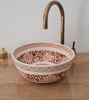 Elegant brown and white ceramic wash basin with a gold faucet, featuring unique Moroccan patterns and a handcrafted finish.