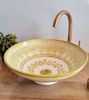 Handmade beige ceramic sink with gold and white MEKHFI design, showcasing Moroccan craftsmanship and mid-century modern style.