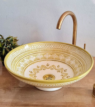 Handmade beige ceramic sink with gold and white MEKHFI design, showcasing Moroccan craftsmanship and mid-century modern style.