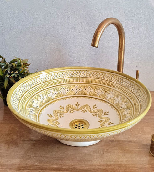 Handmade beige ceramic sink with gold and white MEKHFI design, showcasing Moroccan craftsmanship and mid-century modern style.