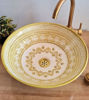 Elegant beige ceramic vessel sink featuring a gold and white MEKHFI pattern, handcrafted in Morocco for unique bathroom decor.