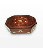 A unique rosewood jewelry box showcasing a carved elephant inlay, decorated with gold chains and pearls for a luxurious touch.