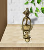 Dhokra art brass figurine depicting a tribal woman grinding spices, intricately crafted to celebrate Indian heritage and tradition.