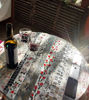 Picture of Round Mosaic tabletop with everyday items cemented in; original round bistro tabletop