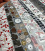 Picture of Round Mosaic tabletop with everyday items cemented in; original round bistro tabletop