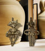Two handmade brass figurines of a tribal couple, showcasing intricate Dhokra art and cultural heritage.