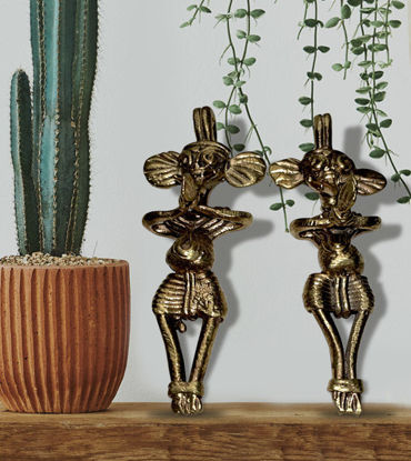 Two handcrafted brass figurines of a man and woman dancing, showcasing traditional Indian Dhokra art and cultural heritage.