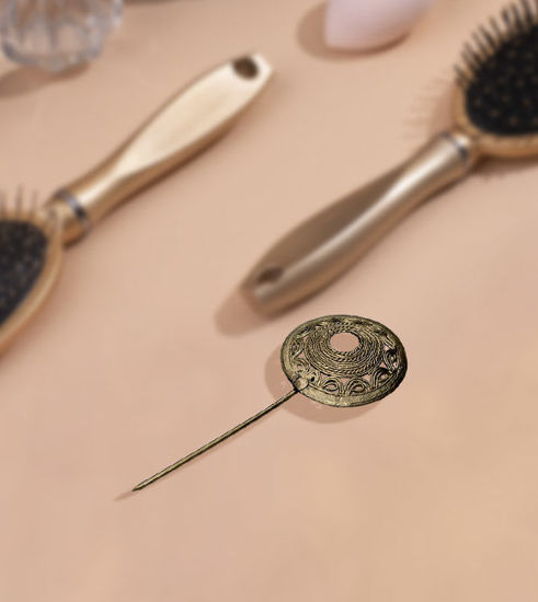 Handmade brass hairpin with a circular design, showcasing intricate detailing and a rustic finish, ideal for weddings and everyday wear.