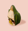 Charming corn cob figurine with a green leaf, crafted from terracotta as part of a Peruvian Christmas ornament.