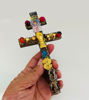 Handmade Caravaca Cross from Arbol de la Chonta wood, representing spiritual protection and well-being.