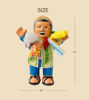 Ekeko figurine, uniquely painted, showcasing traditional Andean attire, believed to attract wealth and blessings.