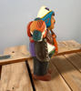 Ekeko doll figurine, 8" tall, depicting a man with a musical instrument, symbolizing abundance and good luck from Peru.