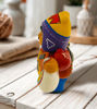 Handmade 5" Ekeko doll figurine of a man holding a guitar, symbolizing good luck and prosperity, from Peru.