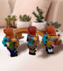 Hand-painted Ekeko doll, 6x2", depicting a man with a guitar, representing good luck and abundance in Andean culture.