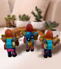 Ekeko doll, 6x2", featuring a man with a guitar, symbolizing prosperity and handcrafted by Peruvian artisans.