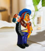 Peruvian Ekeko doll, 9 inches tall, depicting a man with a guitar, representing prosperity and good fortune in Andean culture.