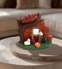 Ethnic nativity scene figurine made of terracotta, showcasing a tree and house, handcrafted by Peruvian artisans with vibrant colors.