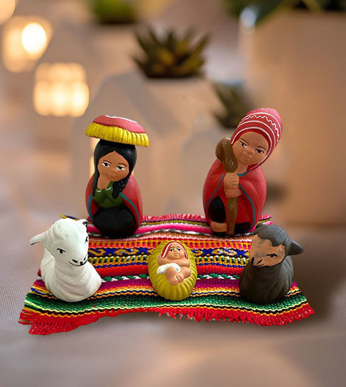 A handmade Mexican-style nativity scene, featuring the Holy Family, crafted by Peruvian artisans with natural paints.