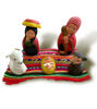 An ethnic nativity scene of the Holy Family, handmade by Peruvian artisans using traditional techniques and natural materials.