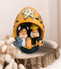 Colorful gourd nativity scene ornament, intricately carved and hand-painted, celebrating Andean holiday traditions.
