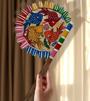Colorful hand-painted wooden fan featuring intricate fish designs, showcasing Bengal Pattachitra folk art for home decor.