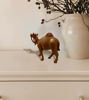 Handcrafted brown wooden camel figurine with rope detail, perfect for rustic or boho décor on shelves and tables.