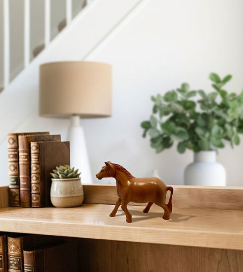 Brown wooden horse figurine on a white background, showcasing a rustic design for play and home décor.
