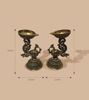 Set of 2 handcrafted brass peacock diyas with ornate designs, ideal for puja, festivals, and enhancing spiritual spaces.